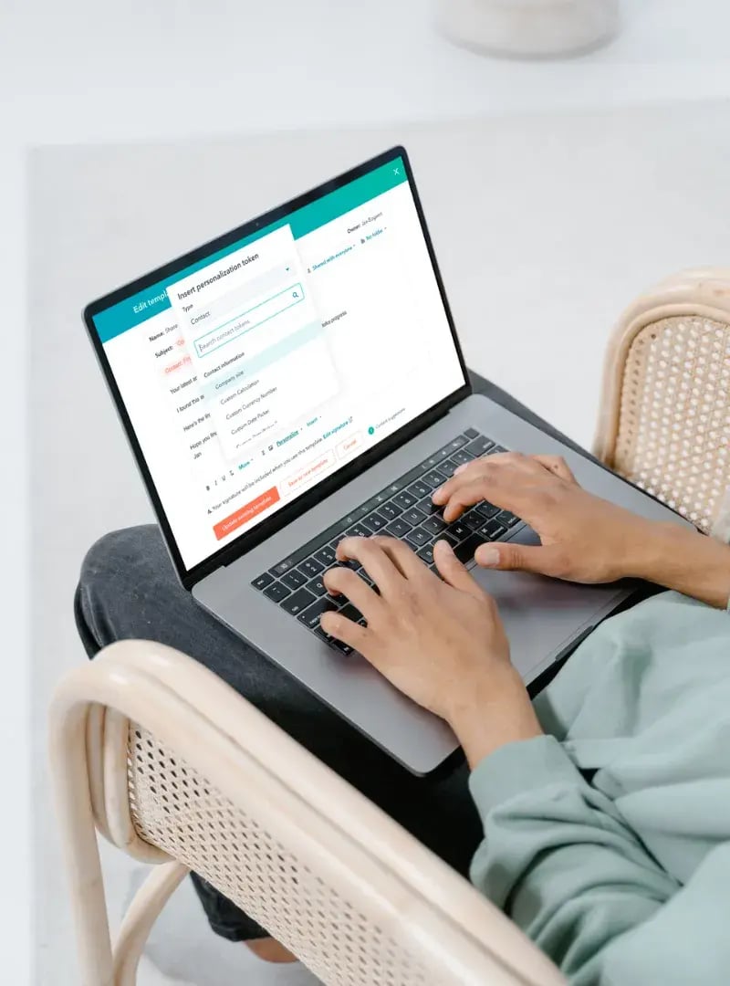 User working on a laptop with HubSpot software open, representing fast-tracked HubSpot onboarding and implementation services.
